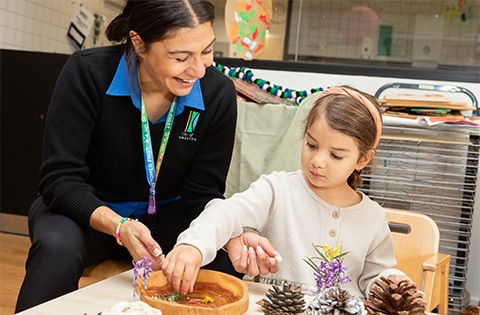 A Kingston educator engaging with a child