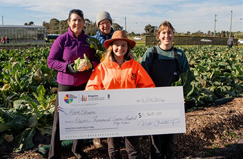 The team from Fareshare with a novelty check