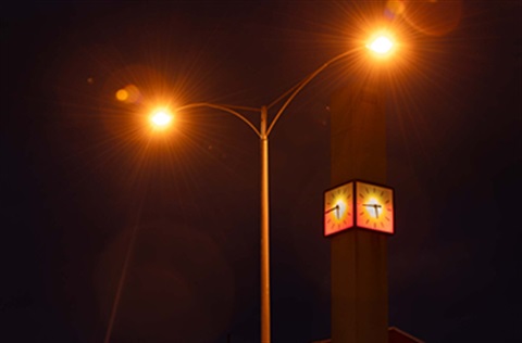 The clock at Kingston City Hall lit up orange