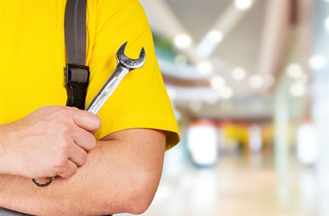 man holding a spanner